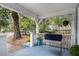 Inviting front porch with seating, hanging plants, and a view of the landscaped yard at 1812 Defoor Nw Ave, Atlanta, GA 30318