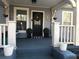 Charming front porch view with a decorated door and beautiful potted plants at 1812 Defoor Nw Ave, Atlanta, GA 30318