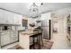 Modern kitchen featuring white cabinets, stainless steel appliances, and a stylish center island at 1812 Defoor Nw Ave, Atlanta, GA 30318