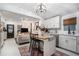 Open concept living room and kitchen with an island and stylish light fixtures at 1812 Defoor Nw Ave, Atlanta, GA 30318