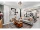 Stylish living room featuring a modern fireplace, chic decor, and open view to the kitchen at 1812 Defoor Nw Ave, Atlanta, GA 30318