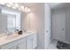 Bright bathroom featuring double sinks, granite countertops and modern fixtures at 2797 Malton Way, Loganville, GA 30052