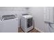 Laundry room featuring a modern washer, dryer, and a wire rack above at 2797 Malton Way, Loganville, GA 30052