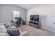 Living room with a couch, tv, desk, and gaming chair at 2797 Malton Way, Loganville, GA 30052