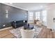 Bright and inviting living room with hardwood floors, contemporary decor, and plenty of natural light at 2797 Malton Way, Loganville, GA 30052