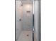Modern shower featuring marble tiling, niche, and glass door at 2797 Malton Way, Loganville, GA 30052