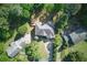 Aerial view of the property showcasing its layout and surrounding lush landscape at 3990 Old Spring House Ct, Atlanta, GA 30338