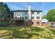Spacious backyard features a deck, brick accents, and a well-maintained lawn at 3990 Old Spring House Ct, Atlanta, GA 30338