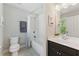 Bathroom with a toilet, tub/shower, and vanity with a dark wood cabinet at 3990 Old Spring House Ct, Atlanta, GA 30338