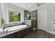 Bathroom with soaking tub under a window and a tiled glass shower, bright with natural light at 3990 Old Spring House Ct, Atlanta, GA 30338