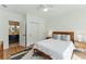 Bright bedroom showcasing modern decor, shiplap walls, and convenient ensuite bathroom access at 3990 Old Spring House Ct, Atlanta, GA 30338