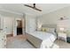 Serene bedroom boasts soft natural light, creating a peaceful retreat, and a view into the bathroom at 3990 Old Spring House Ct, Atlanta, GA 30338