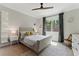 Light-filled bedroom featuring neutral colors, a comfortable bed, and a scenic view through the window at 3990 Old Spring House Ct, Atlanta, GA 30338