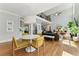 Open-concept dining area with modern lighting, wooden floors, and seamless flow to living spaces, ideal for entertaining at 3990 Old Spring House Ct, Atlanta, GA 30338