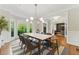 Bright dining room featuring coffered ceilings, stylish seating for six, and a view of office at 3990 Old Spring House Ct, Atlanta, GA 30338