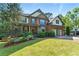 Charming two-story brick home with a manicured front lawn and inviting entryway at 3990 Old Spring House Ct, Atlanta, GA 30338