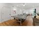 Recreation area featuring a ping pong table and easy access to the living room and other entertainment at 3990 Old Spring House Ct, Atlanta, GA 30338