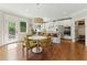 Sunlit kitchen with a breakfast nook, granite countertops, stainless steel appliances, and ample cabinet space at 3990 Old Spring House Ct, Atlanta, GA 30338