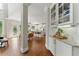 Bright open concept kitchen features stainless steel appliances, granite countertops, and hardwood floors at 3990 Old Spring House Ct, Atlanta, GA 30338