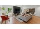 Open-concept living room featuring a modern fireplace, sleek lighting and comfortable seating area at 3990 Old Spring House Ct, Atlanta, GA 30338