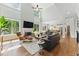 Spacious living room with hardwood floors, soaring ceilings, large windows and an inviting fireplace at 3990 Old Spring House Ct, Atlanta, GA 30338