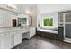 Main bathroom offers dual sinks, vanity, soaking tub, and walk-in shower perfect for a spa-like experience at 3990 Old Spring House Ct, Atlanta, GA 30338