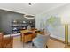 Stylish home office with modern light fixture, sleek desk, and a striking world map at 3990 Old Spring House Ct, Atlanta, GA 30338