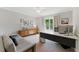 Bright office area with modern desk, comfortable sofa, and neutral color palette at 3990 Old Spring House Ct, Atlanta, GA 30338