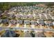 An aerial view of a neighborhood in the suburbs with many trees at 4425 Atwood Dr, Cumming, GA 30040