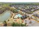 Neighborhood aerial view featuring a community pool, lake, playground, and walking trails at 4425 Atwood Dr, Cumming, GA 30040