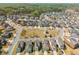 An aerial view of the neighborhood showing well-maintained homes, streets, and a central green space at 4425 Atwood Dr, Cumming, GA 30040