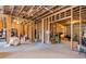 Unfinished basement with exposed framing offers potential for customization and storage at 4425 Atwood Dr, Cumming, GA 30040