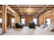 Unfinished basement features exposed wood framing, two sofas, and natural light from egress windows at 4425 Atwood Dr, Cumming, GA 30040