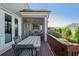 Cozy deck with seating and an outdoor fireplace on a screened-in porch at 4425 Atwood Dr, Cumming, GA 30040