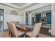 Bright dining area open to an office, featuring stylish furnishings, plenty of light, and an open floor plan at 4425 Atwood Dr, Cumming, GA 30040