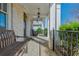 Cozy covered front porch featuring stone flooring and white columns at 4425 Atwood Dr, Cumming, GA 30040