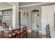Hallway featuring access to rooms, overhead lighting, and dark wood flooring at 4425 Atwood Dr, Cumming, GA 30040