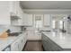 Modern kitchen with stainless steel appliances, island, and granite countertops at 4425 Atwood Dr, Cumming, GA 30040