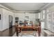 Open kitchen with stainless steel appliances, white cabinets, and dining table at 4425 Atwood Dr, Cumming, GA 30040
