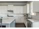 Bright kitchen featuring white cabinets, granite countertops, and stainless steel appliances at 4425 Atwood Dr, Cumming, GA 30040