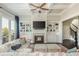 Gathering room with fireplace, built-ins, coffered ceiling and large windows at 4425 Atwood Dr, Cumming, GA 30040