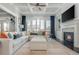Bright living room with fireplace, built-ins, and large sectional sofa at 4425 Atwood Dr, Cumming, GA 30040