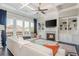 Living room with fireplace, built-ins, coffered ceiling and large windows at 4425 Atwood Dr, Cumming, GA 30040