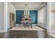 Stylish office with hardwood floors, large window, and custom shelving at 4425 Atwood Dr, Cumming, GA 30040