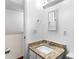 Bathroom with a stylish granite countertop and modern fixtures at 8827 Applegate Ln, Atlanta, GA 30350