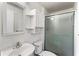 Compact bathroom featuring a shower with sliding glass doors, and neutral fixtures and finishes at 8827 Applegate Ln, Atlanta, GA 30350