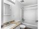Bathroom with a bathtub and shower, granite countertop, and stylish fixtures at 8827 Applegate Ln, Atlanta, GA 30350