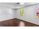 This bedroom features windows that let in natural light and a dark wood floor at 8827 Applegate Ln, Atlanta, GA 30350