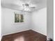 Bright bedroom features hardwood floor, natural light, and a ceiling fan at 8827 Applegate Ln, Atlanta, GA 30350
