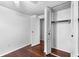This bedroom includes a closet for storage and hardwood flooring at 8827 Applegate Ln, Atlanta, GA 30350